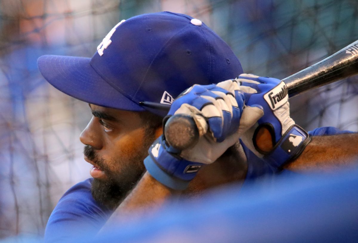 Dodgers outfielder Andrew Toles takes batting practice before NLCS Game 6.