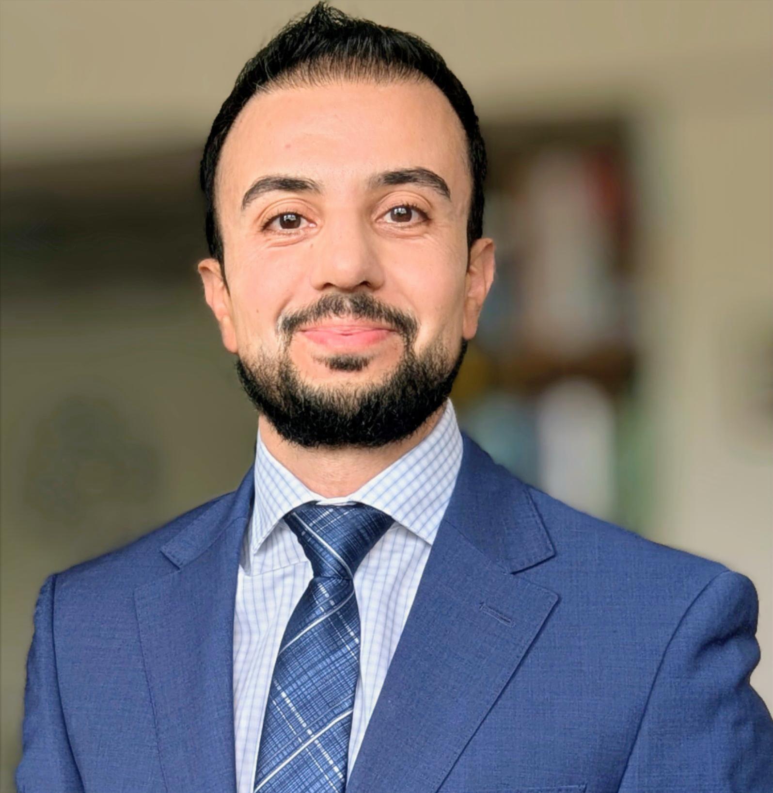 Mental health professional in office attire smiling confidently