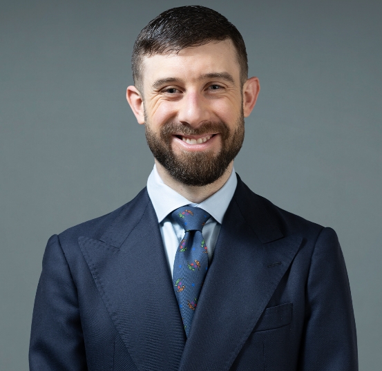 Psychiatrist in formal attire presenting at mental health conference