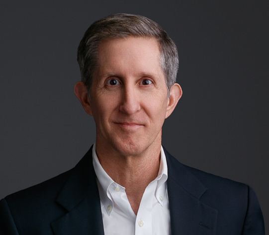 Psychiatrist in formal attire with a neutral background