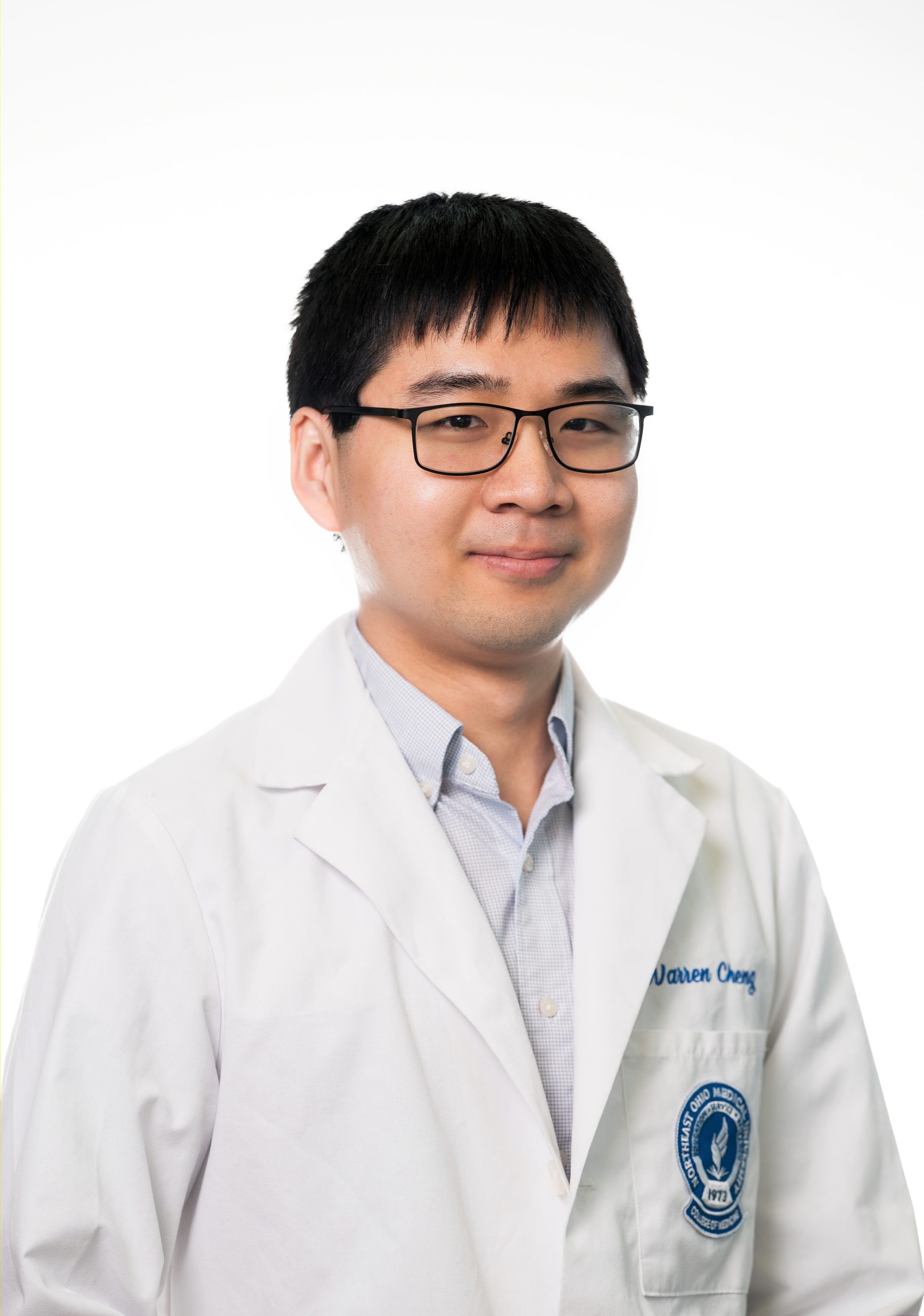 Medical professional in lab coat in a clinical setting