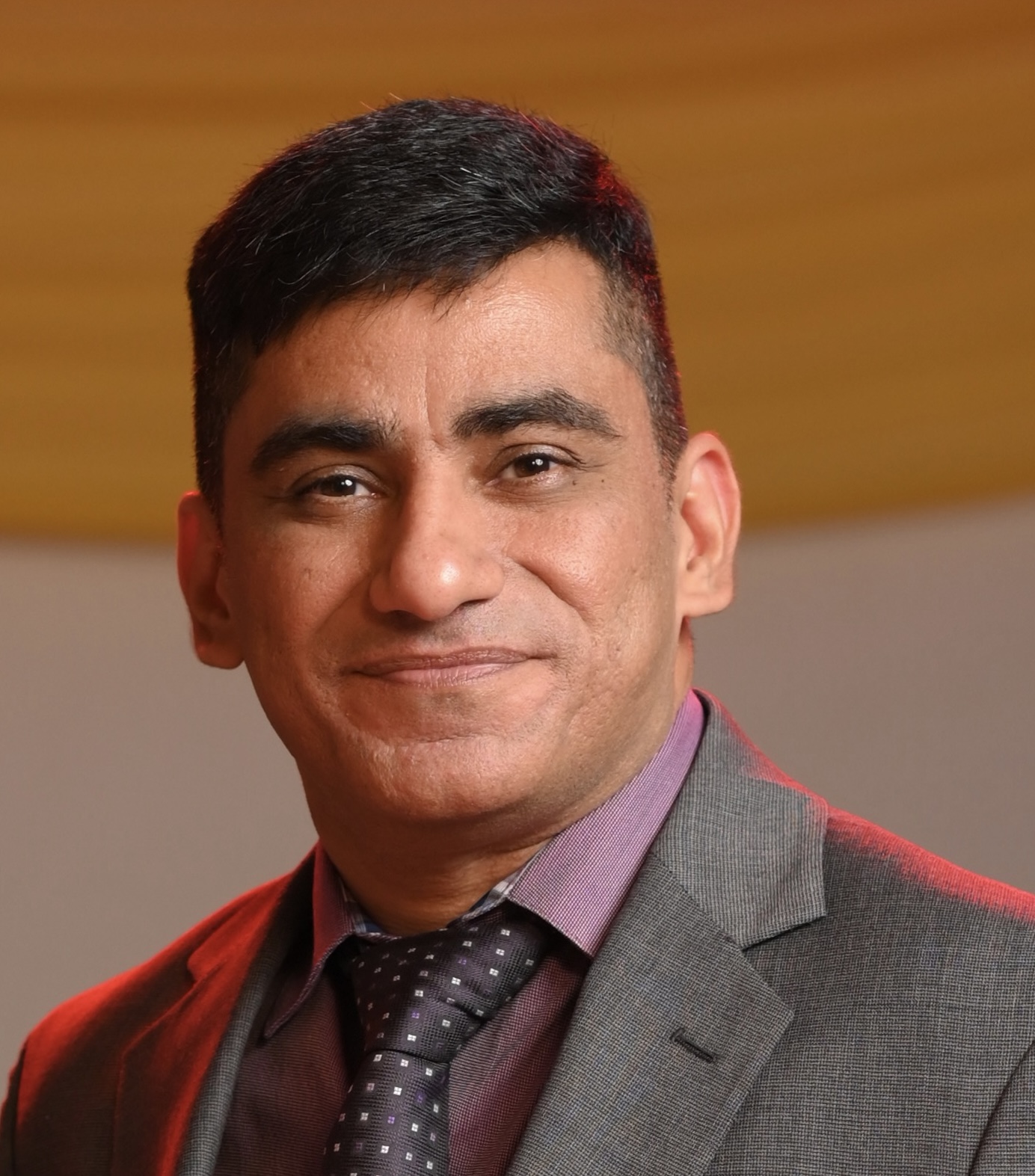 Psychiatrist in professional attire in clinical office setting